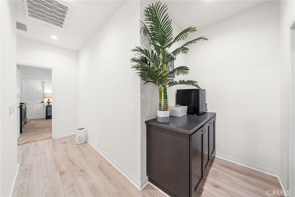 329 North Standard Avenue Santa Ana, CA 92701 - Photo 18 of 34 a view of a room with a potted plant and wooden floor