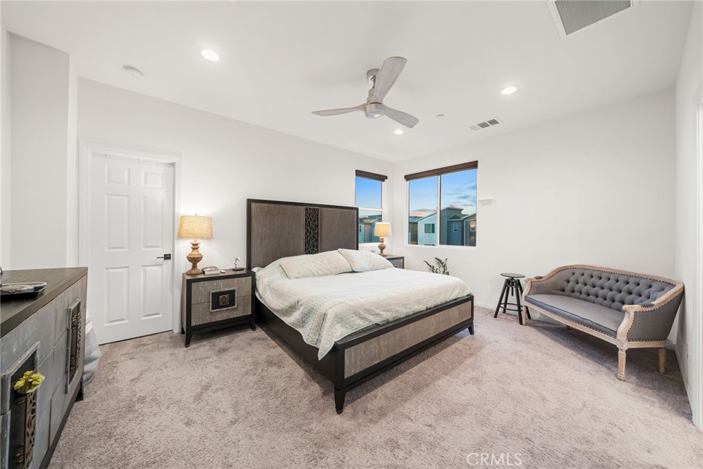 329 North Standard Avenue Santa Ana, CA 92701 - Photo 25 of 34 a spacious bedroom with a bed and a couch