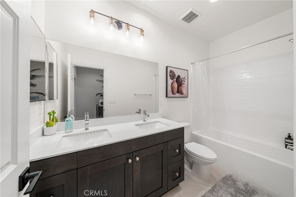 329 North Standard Avenue Santa Ana, CA 92701 - Photo 26 of 34 a bathroom with a sink a toilet and shower