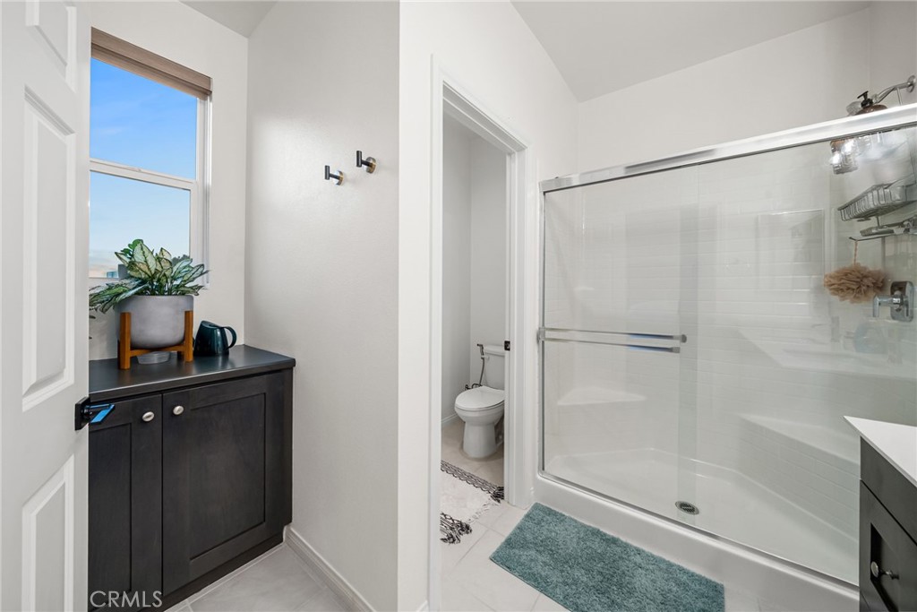 329 North Standard Avenue Santa Ana, CA 92701 - Photo 27 of 34 a bathroom with a shower and a sink