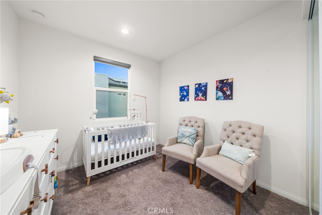 329 North Standard Avenue Santa Ana, CA 92701 - Photo 28 of 34 a bedroom with a bed and a couch