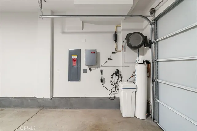 a spacious bedroom with a bed and couch