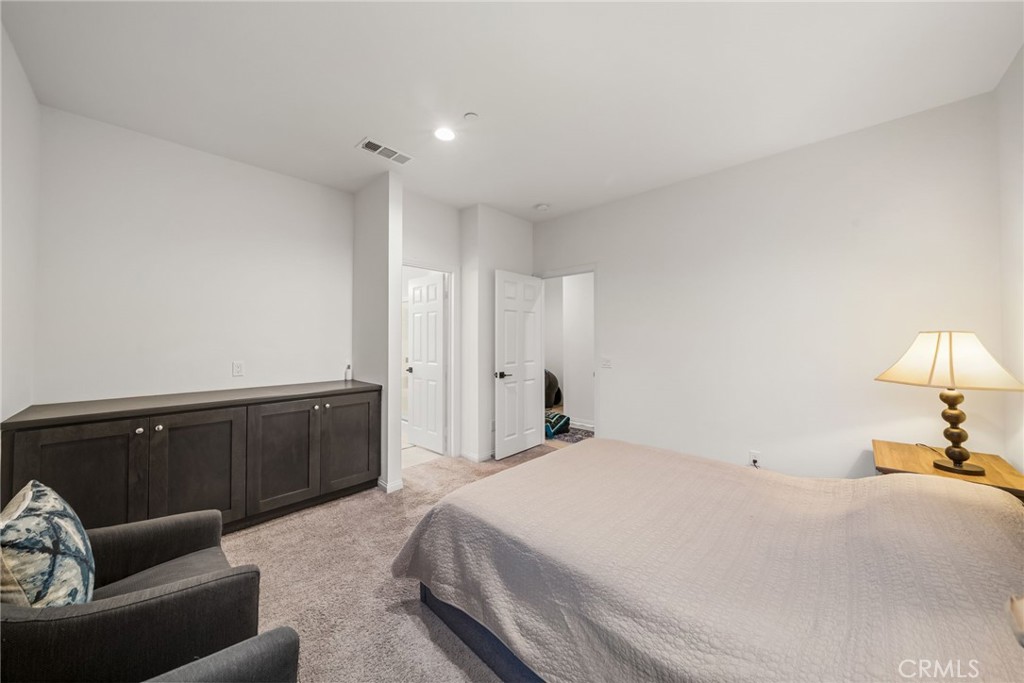 329 North Standard Avenue Santa Ana, CA 92701 - Photo 30 of 34 a spacious bedroom with a bed and couch