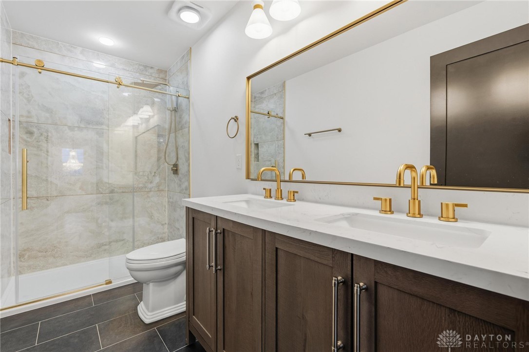 3509 South State Rte 72 Sabina, OH 45169 - Photo 33 of 44 This modern bathroom features dual sinks and a spacious shower.