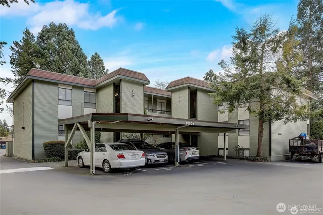 a view of a car park in front of house