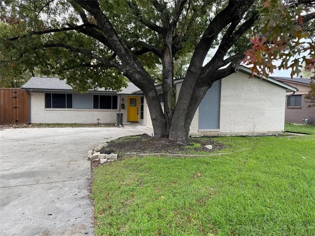 a front view of a house with yard