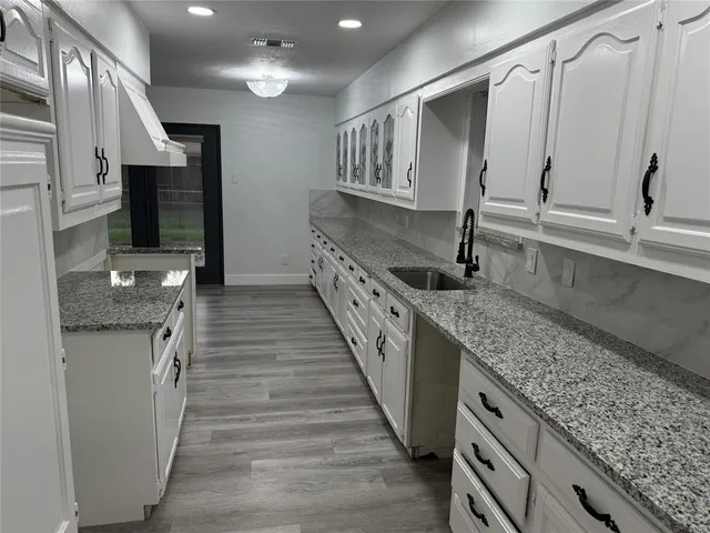 a kitchen with granite countertop lots of counter top space