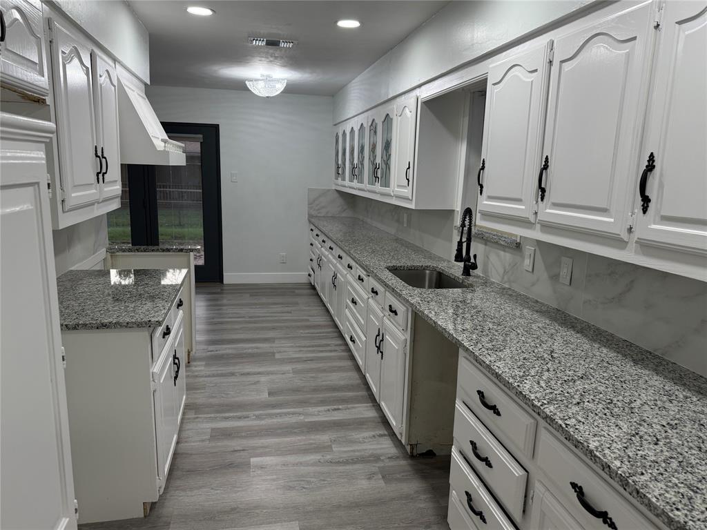 2847 West Rochelle Road Irving, TX 75062 - Photo 3 of 14 a kitchen with granite countertop lots of counter top space