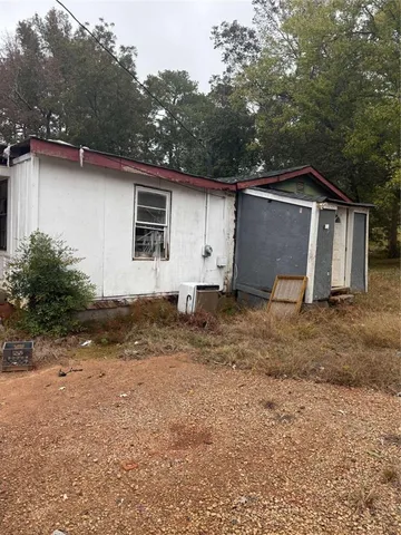 a house with yard in the background