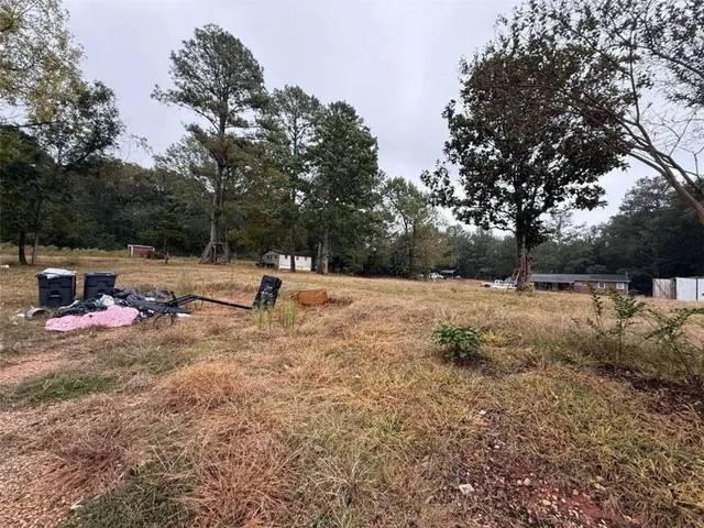 a view of a yard with a tree