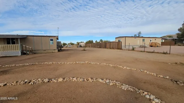 a view of a house with a road