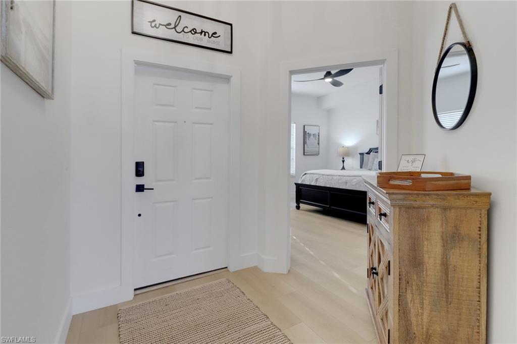 a bathroom with a granite countertop sink a mirror and shower