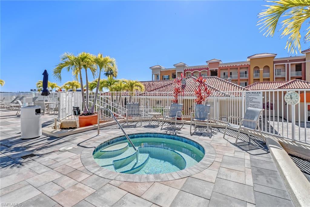 451 Bayfront Place, Unit 5505 Naples, FL 34102 - Photo 18 of 23 a swimming pool with outdoor seating and yard