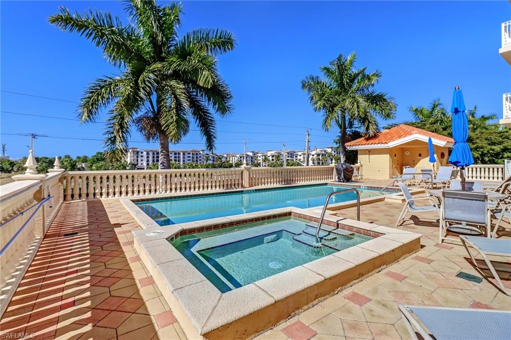451 Bayfront Place, Unit 5505 Naples, FL 34102 - Photo 20 of 23 a view of swimming pool with chairs