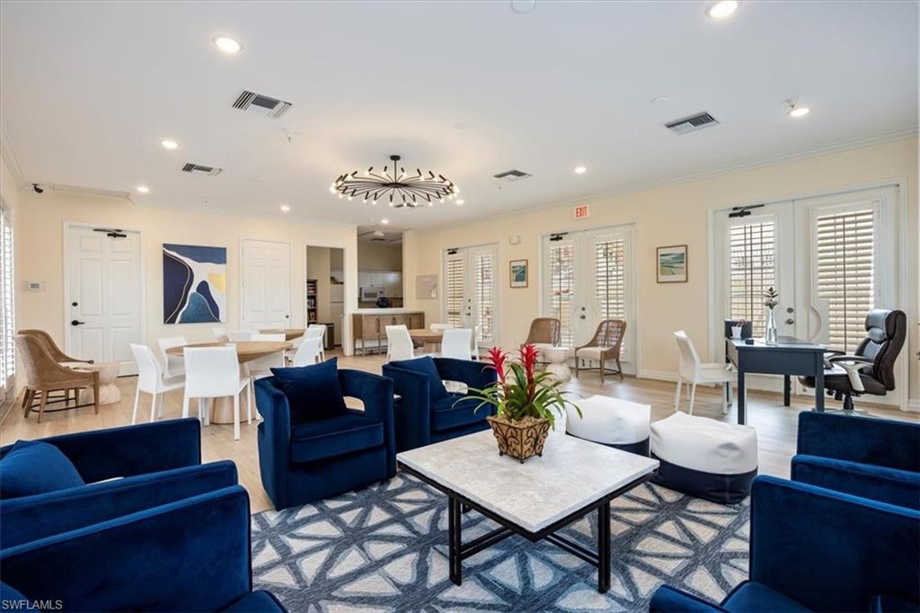 451 Bayfront Place, Unit 5505 Naples, FL 34102 - Photo 22 of 23 a living room with furniture kitchen view and a large window