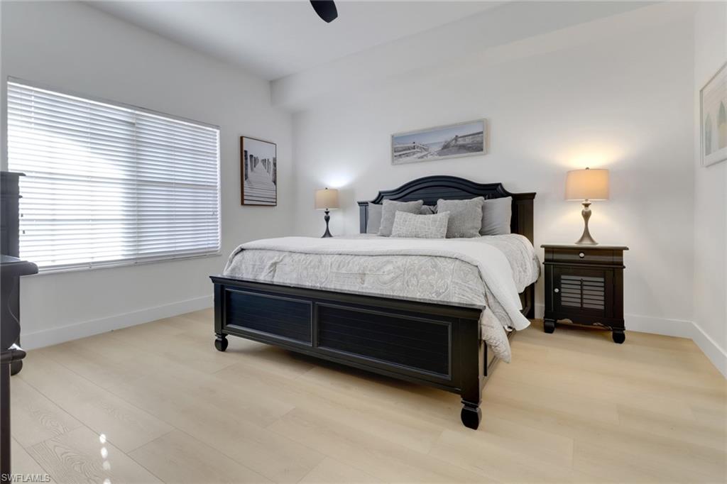 451 Bayfront Place, Unit 5505 Naples, FL 34102 - Photo 8 of 23 a bedroom with a bed and a window
