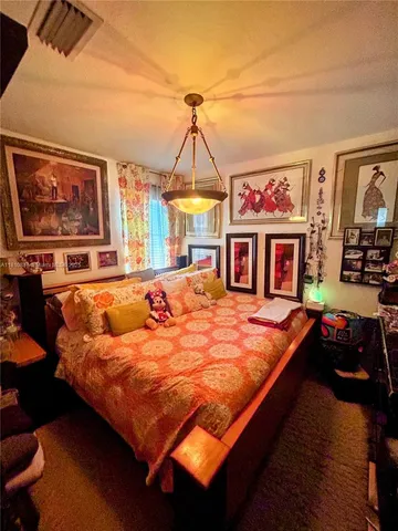 a bed sitting in the middle of a room