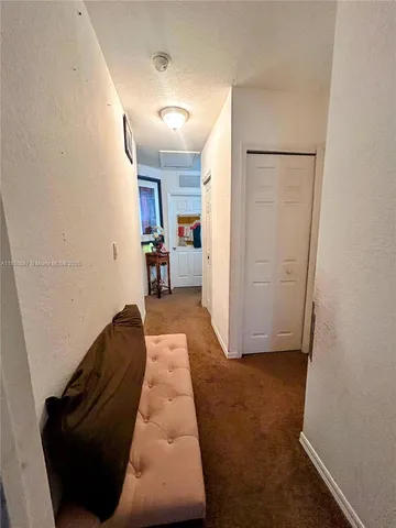 a room with a bed and a chandelier