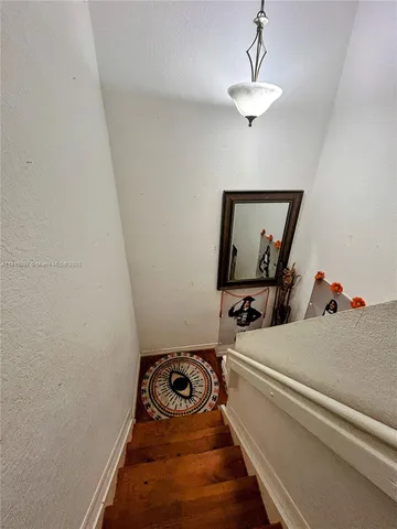 a view of a backyard with sitting area