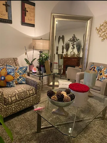 a bedroom with furniture and a painting on the wall