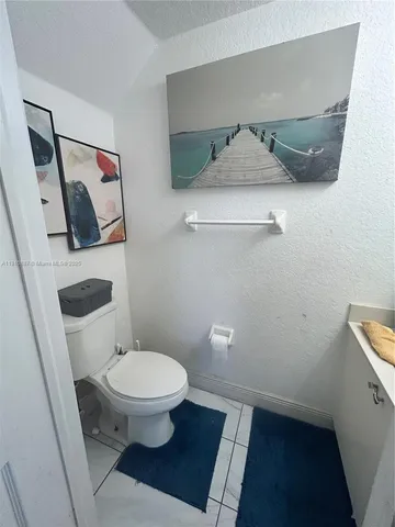 a bathroom with a toilet and a vanity