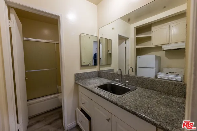 a bathroom with a sink and a shower