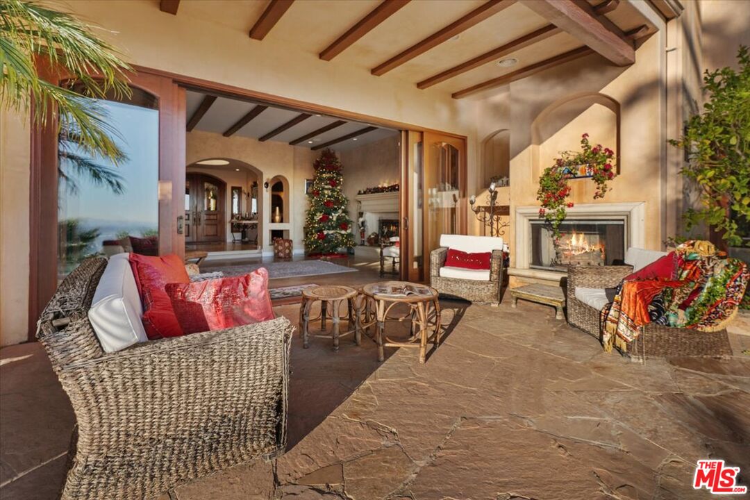 1740 Carla Ridge Beverly Hills, CA 90210 - Photo 12 of 36 a outdoor living space with furniture and fireplace