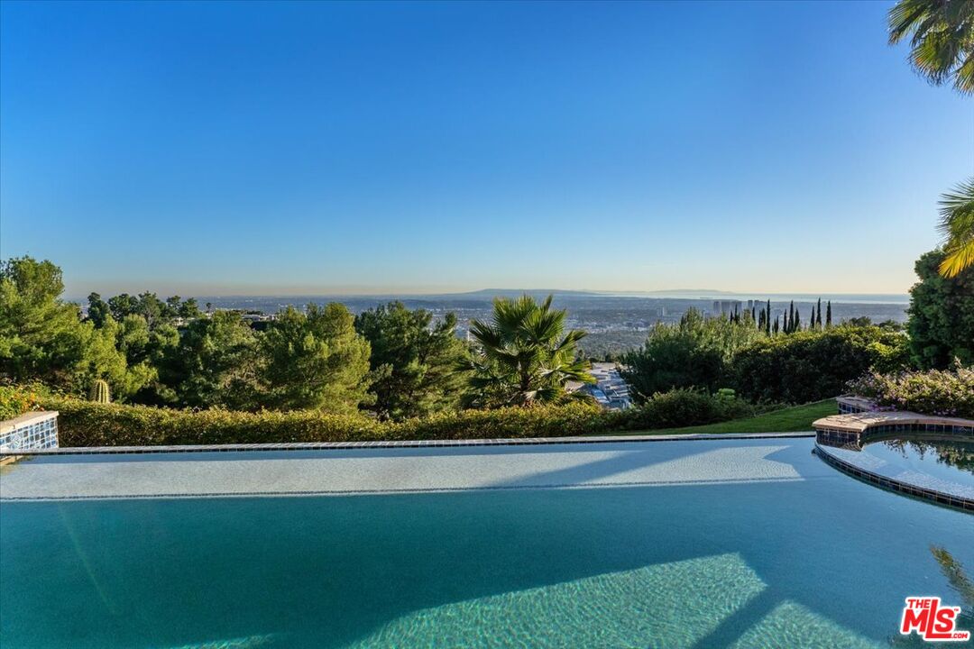 1740 Carla Ridge Beverly Hills, CA 90210 - Photo 15 of 36 a view of a yard with an outdoor seating