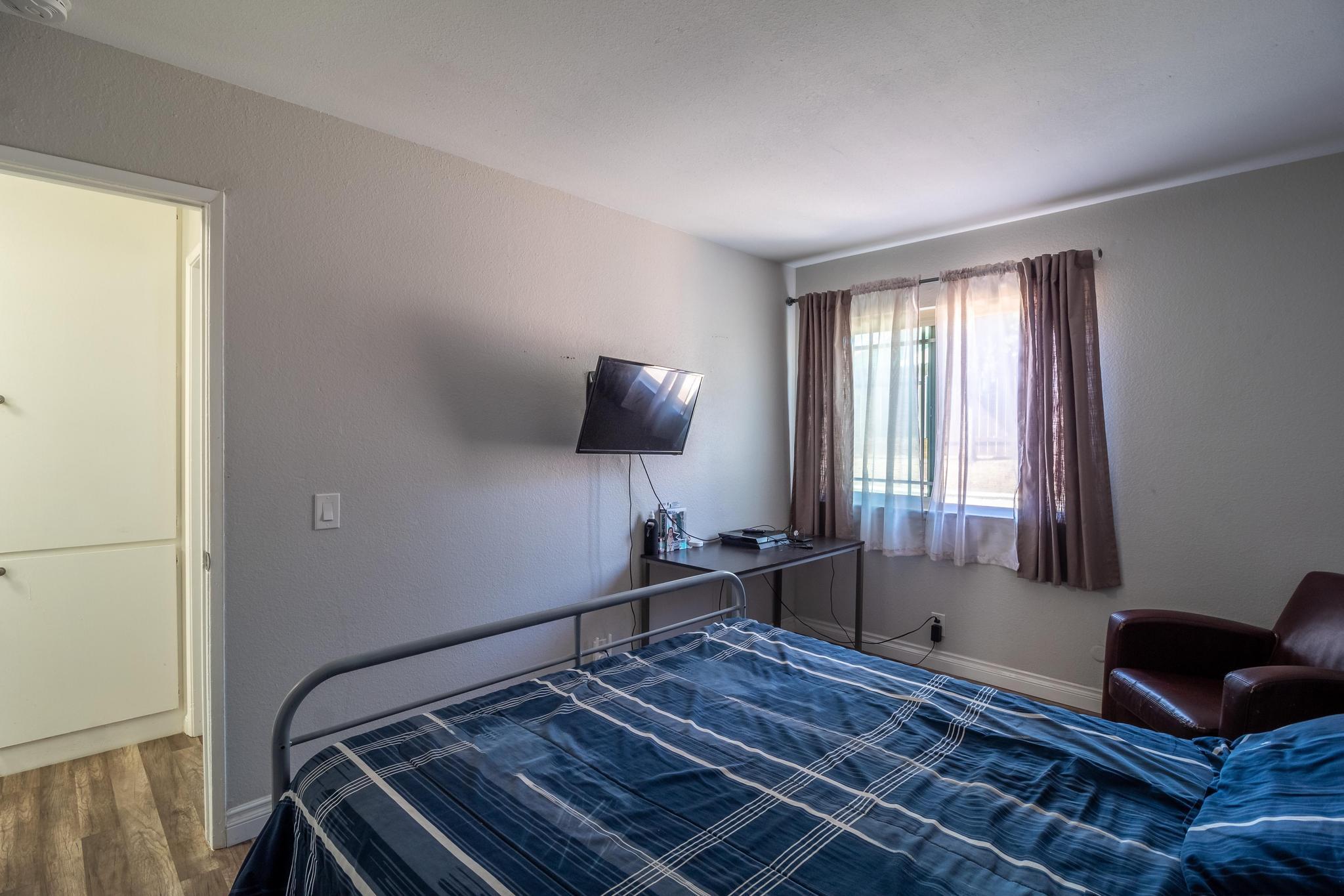 6875 Crest Avenue Riverside, CA 92503 - Photo 23 of 31 a bed room with a bed and a window