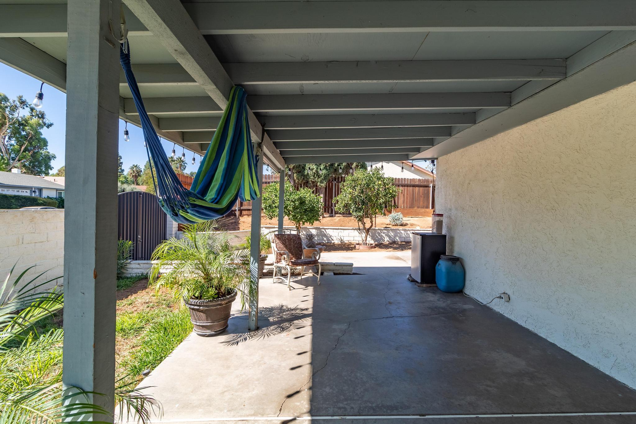 6875 Crest Avenue Riverside, CA 92503 - Photo 27 of 31 a view of a porch with chairs and potted plants