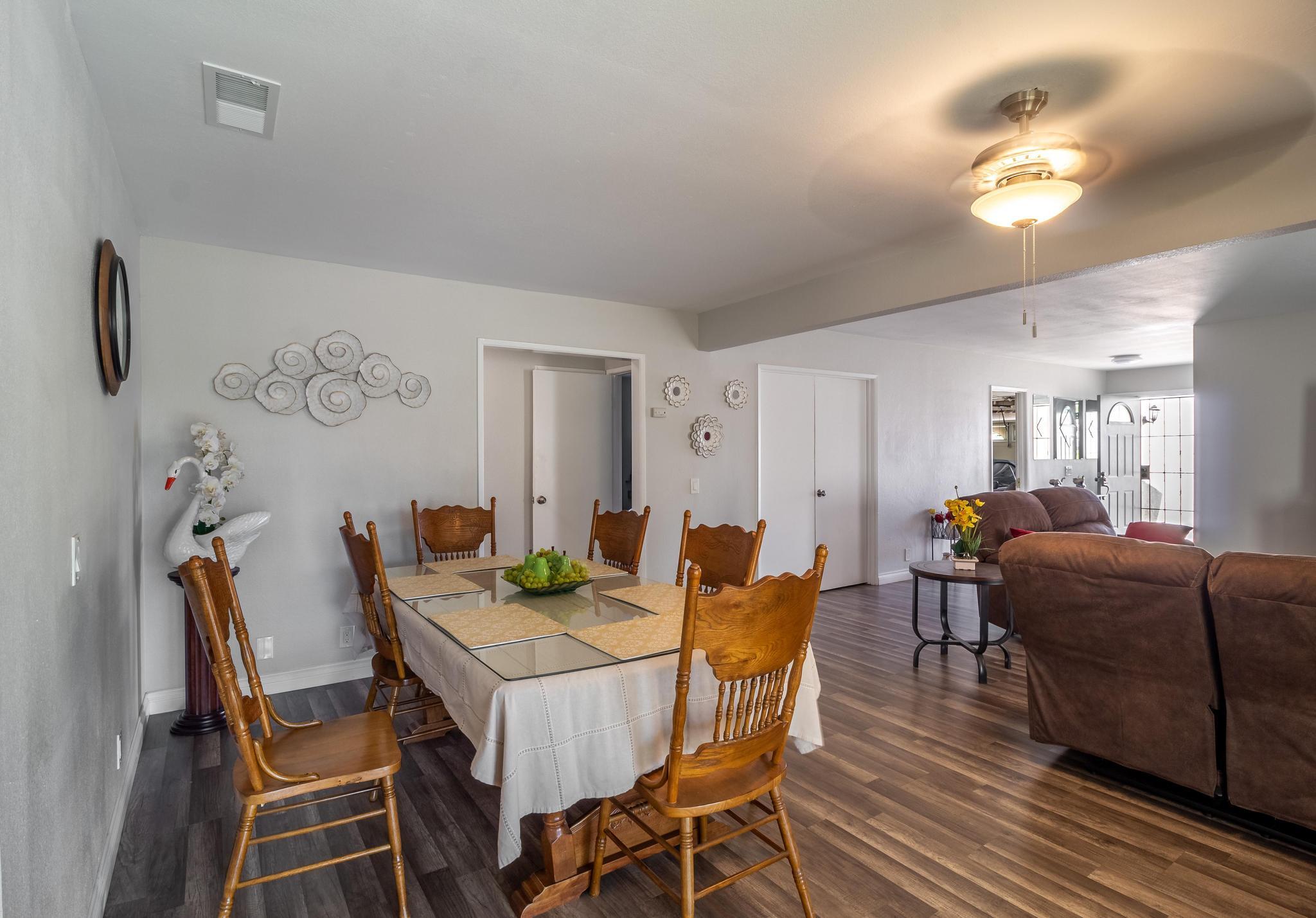 6875 Crest Avenue Riverside, CA 92503 - Photo 6 of 31 a view of a dining room with furniture and wooden floor