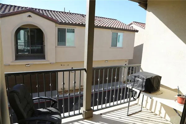 a view of a balcony with chairs