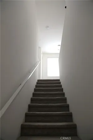 a view of a balcony with furniture