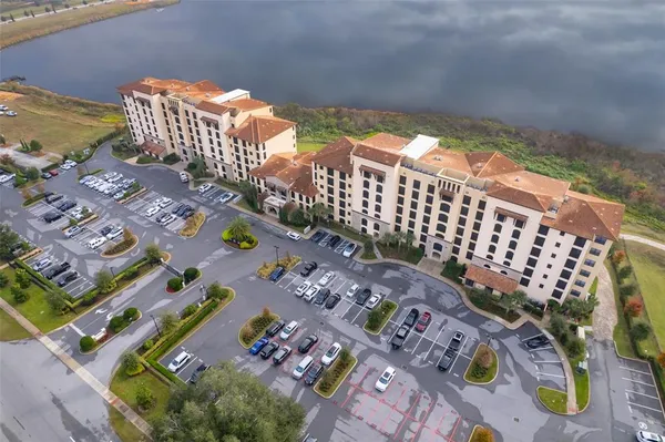 an aerial view of a residential houses with outdoor space