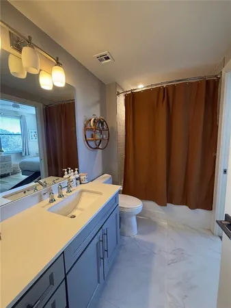 a view of roof deck with wooden floor and lake view