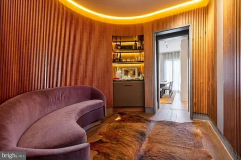 a living room with furniture and a gate
