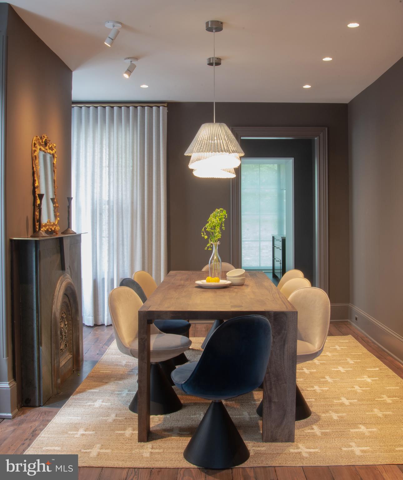 1524 29th Street Northwest Washington, DC 20007 - Photo 12 of 26 a view of a dining room with furniture and a chandelier