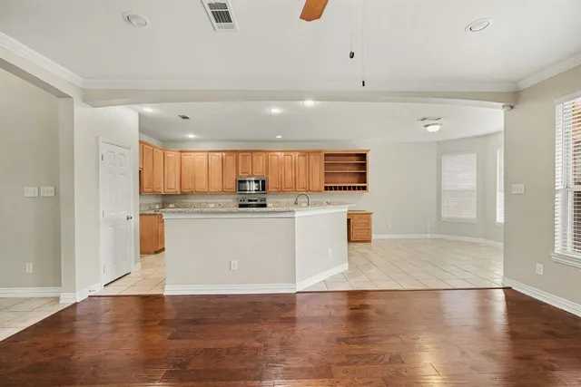 a view of kitchen with wooden floor