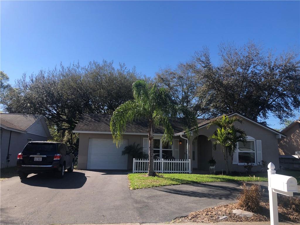 3433 Dellefield Street New Port Richey, FL 34655 - Photo 1 of 1 Circular driveway enhances the view of this well maintained home inviting you to look inside!