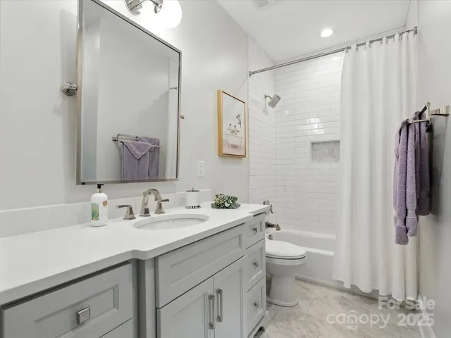 a bathroom with a double vanity sink and mirror