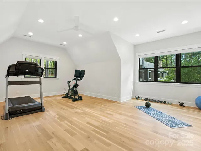 a room with gym equipment and a large window