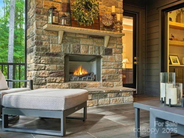 a outdoor living space with furniture and a fireplace