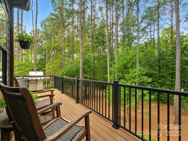 a view of a chairs and table in the balcony