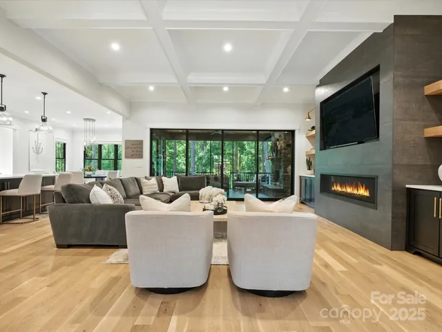 a living room with couches and a flat screen tv