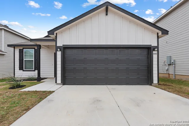 a front view of a house with a garage