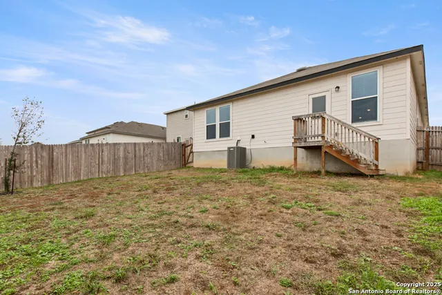 a house view with a backyard space