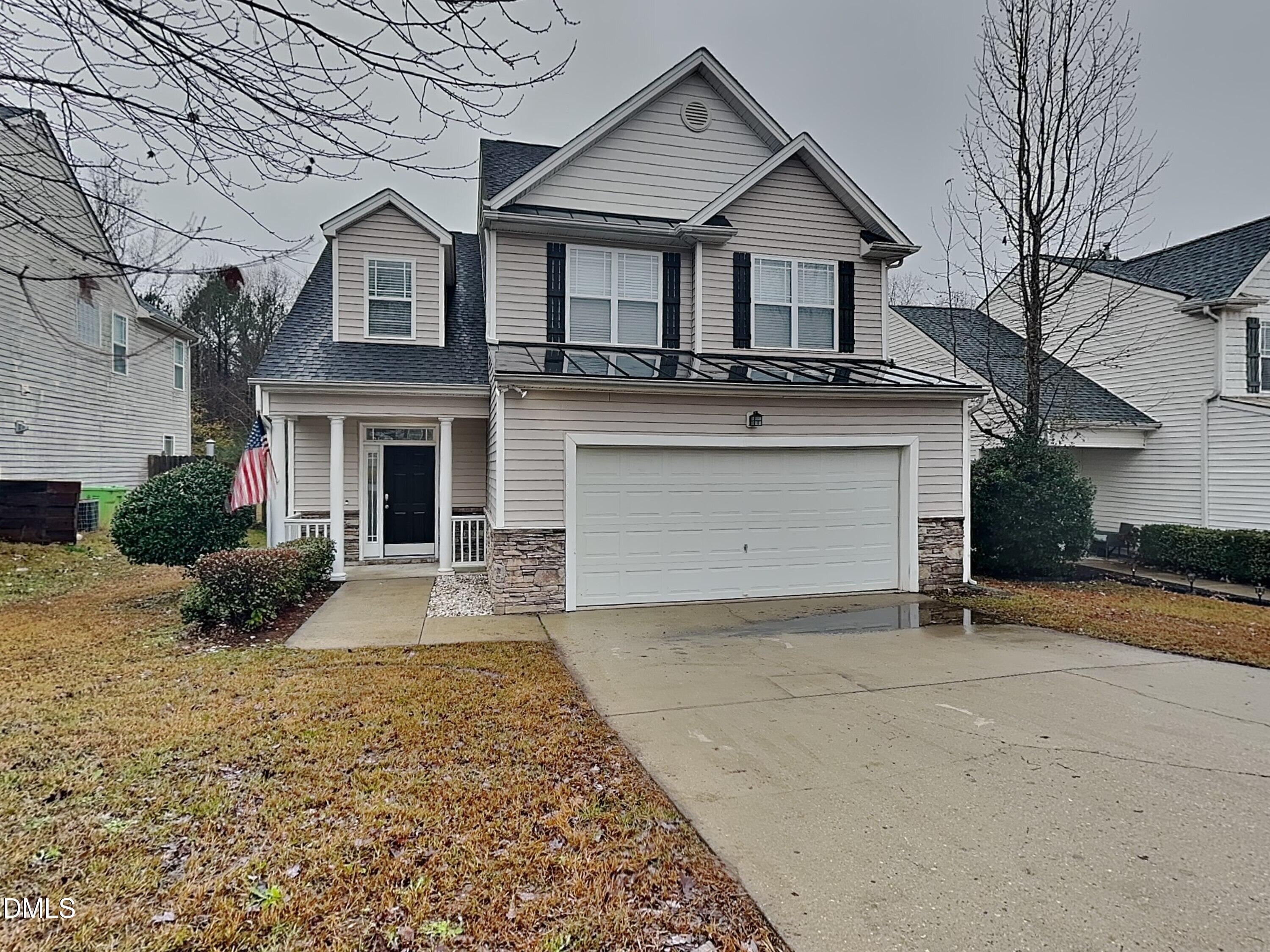 front view of a house with a yard