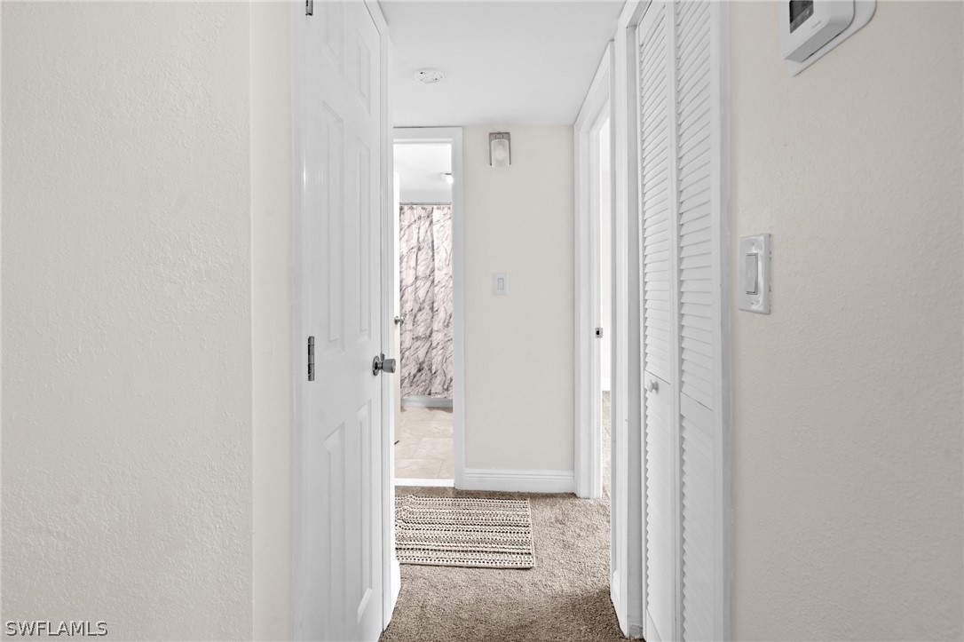 4608 Southeast 6th Avenue, Unit 1D Cape Coral, FL 33904 - Photo 23 of 49 a view of a bathroom with a shower and a bathroom