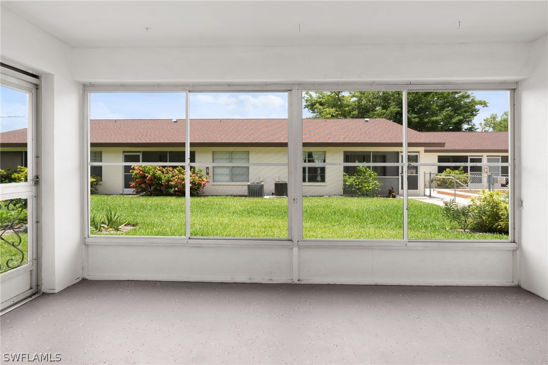 4608 Southeast 6th Avenue, Unit 1D Cape Coral, FL 33904 - Photo 3 of 49 a view of house with a yard and outdoor seating