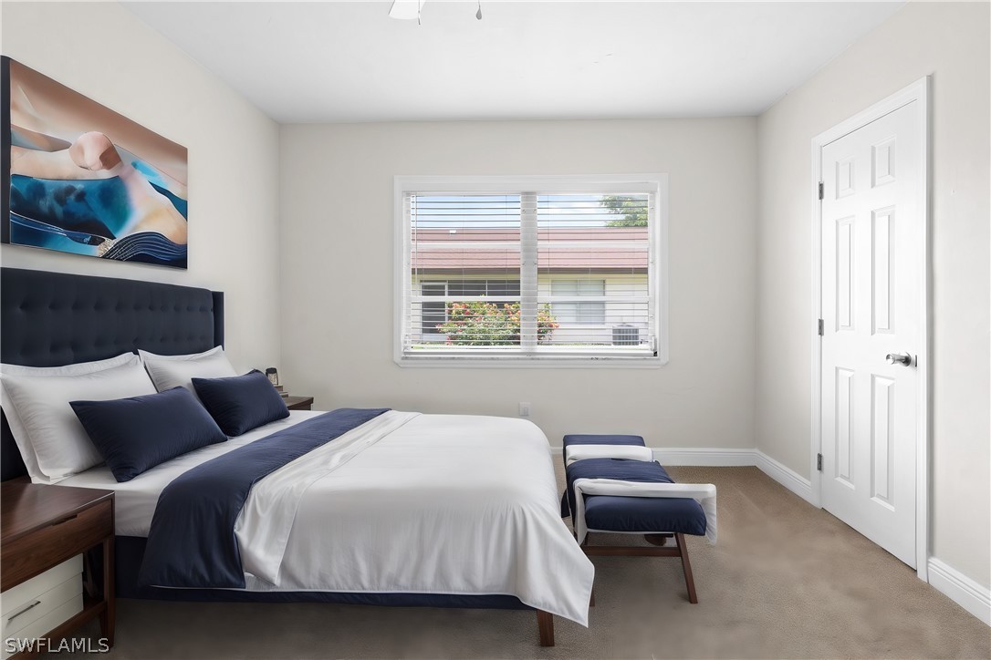 4608 Southeast 6th Avenue, Unit 1D Cape Coral, FL 33904 - Photo 32 of 49 a bedroom with a bed and a window